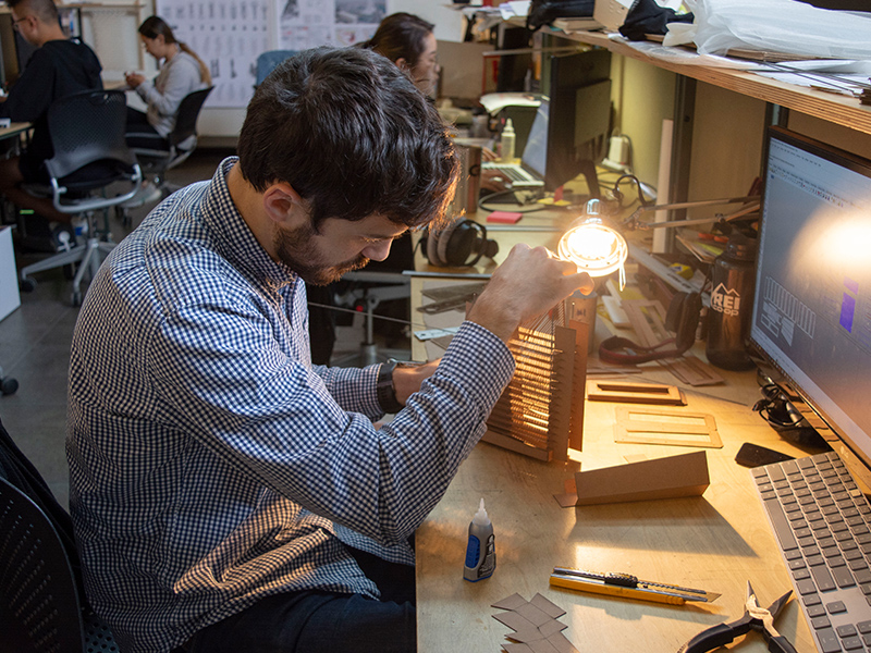 M.Arch Student, Alex Knight, observes how his model responds to light for Keith Kaseman's Fall 2018 studio.