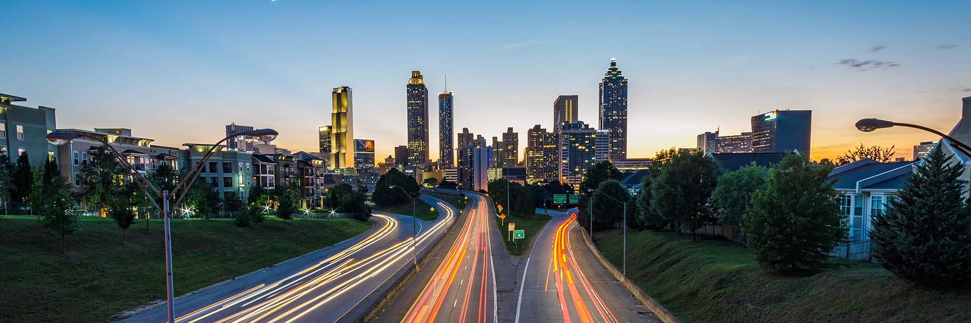 Photo by Joey Kyber on Unsplash of Atlanta skyline with interstate traffic