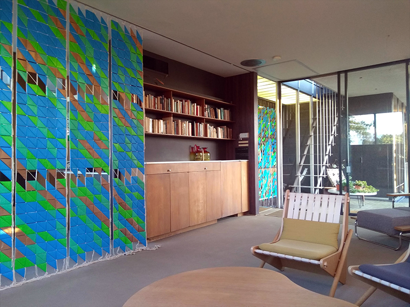 Photo from the interior of the Neutra VDL Research House in Los Angeles with Cottle's green and blue Installation on the wall from his THE COST OF MONEY exhibition.
