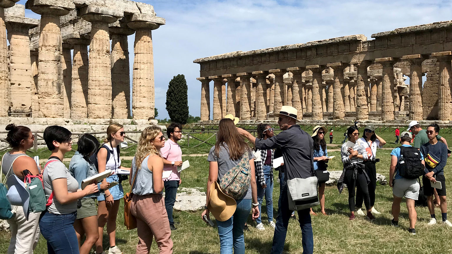 student group in front of two doric temples in Paestum