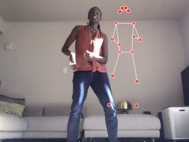 A woman and digital wireframe of a human dancing together.