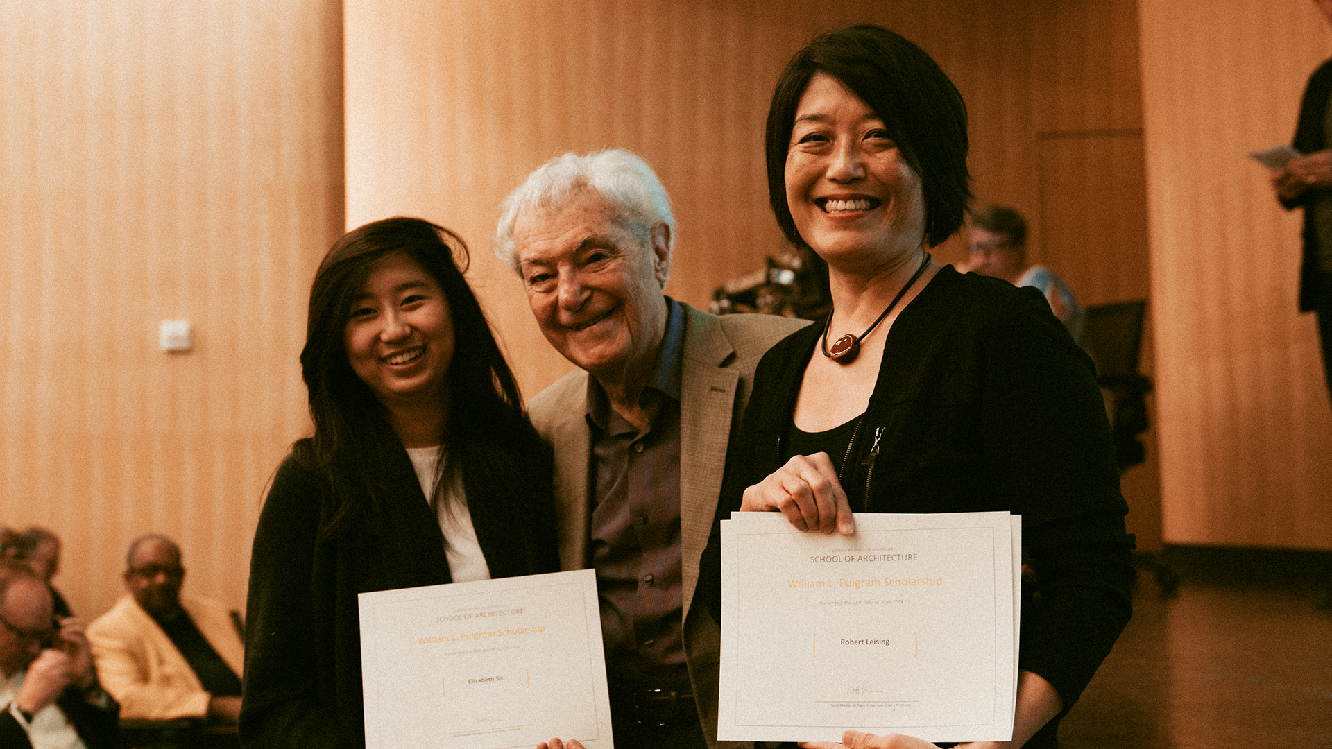 Elizabeth Sit, Bill Pulgram, and Julie Kim at the 2019 Awards Program in the Reinsch-Pierce Family Auditorium.