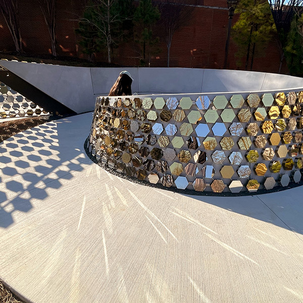 A photograph of the Path of Progress bench in morning light