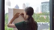 Pre-College Architecture Student uses a window as a surface to sketch her rendering